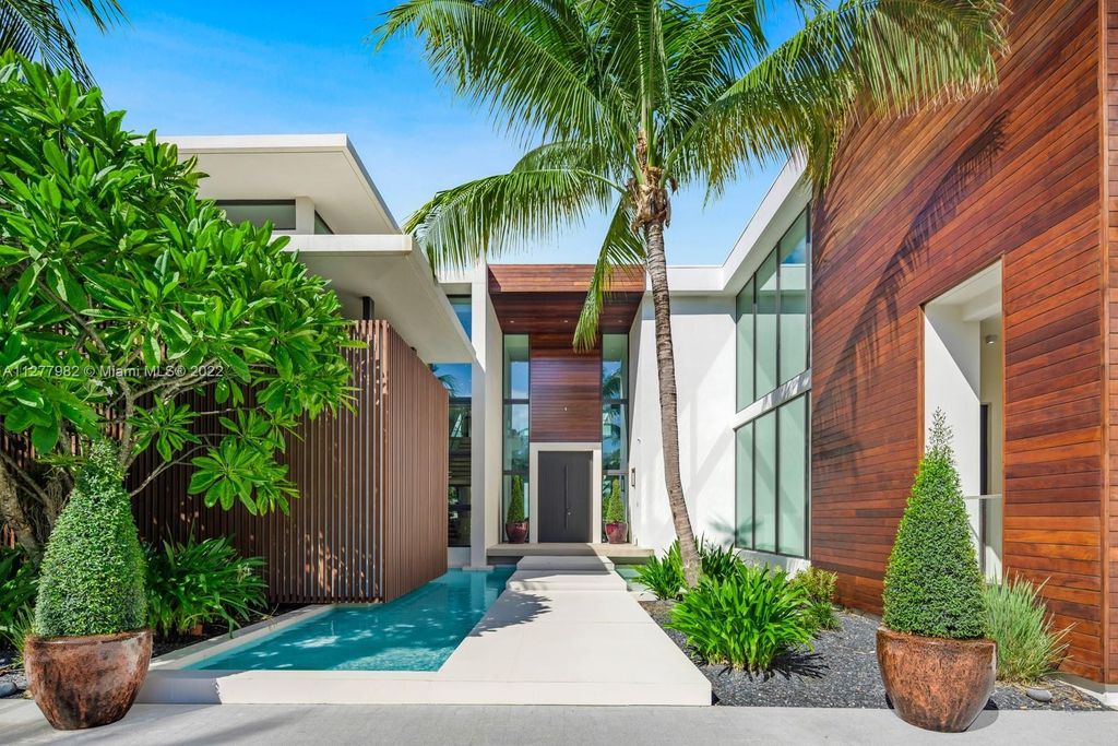 The Miami Beach Home, a tropical modern masterpiece with 110 foot of water frontage designed by Choeff Levy Fischman featuring luxurious amenities for extraordinary Florida waterfront living is now available for sale. This home located at 6480 Allison Rd, Miami Beach, Florida