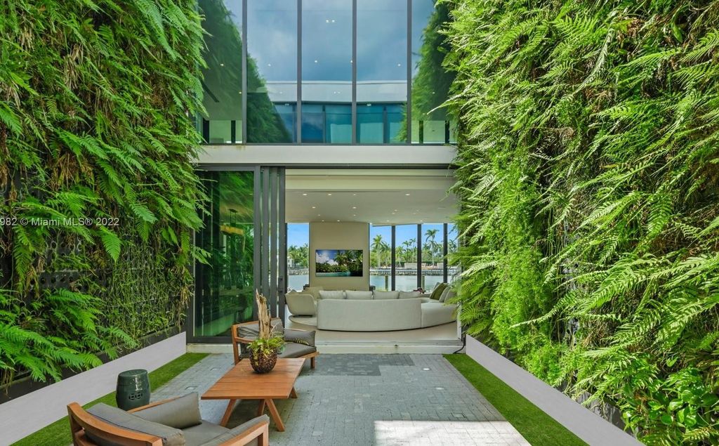 The Miami Beach Home, a tropical modern masterpiece with 110 foot of water frontage designed by Choeff Levy Fischman featuring luxurious amenities for extraordinary Florida waterfront living is now available for sale. This home located at 6480 Allison Rd, Miami Beach, Florida