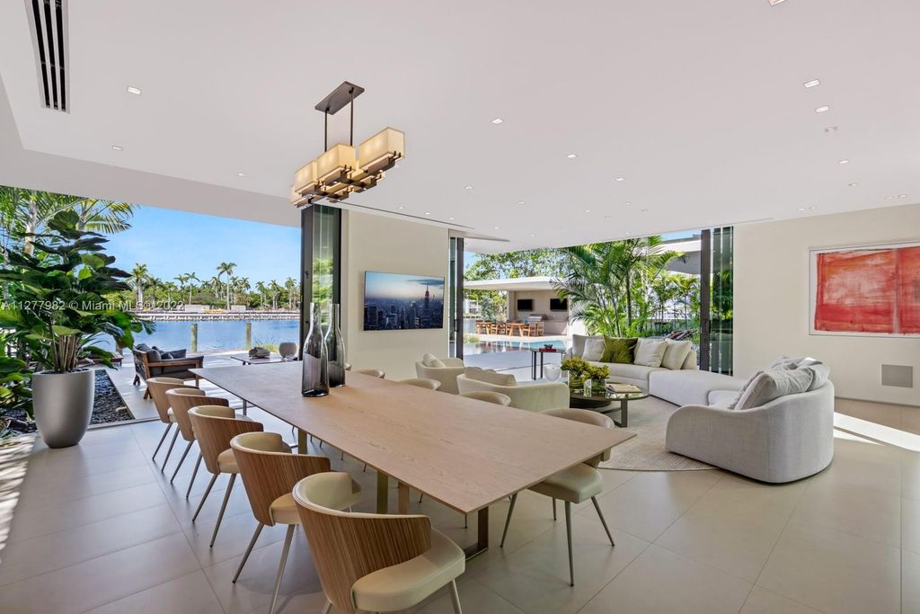 The Miami Beach Home, a tropical modern masterpiece with 110 foot of water frontage designed by Choeff Levy Fischman featuring luxurious amenities for extraordinary Florida waterfront living is now available for sale. This home located at 6480 Allison Rd, Miami Beach, Florida