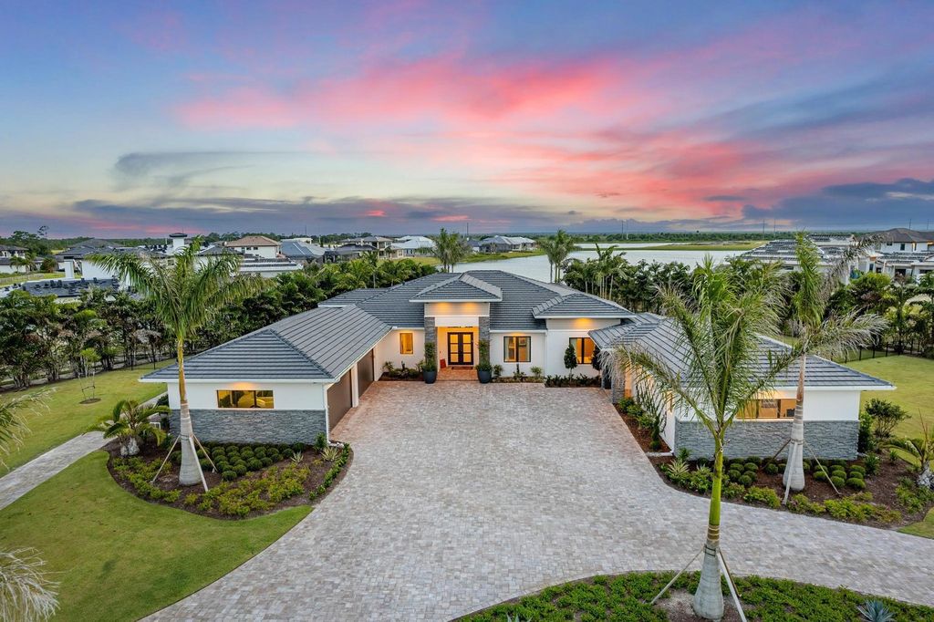 The Home in Rockledge, a lavish lakefront estate has a spacious family room, a fountain saltwater pool, spa, a gorgeous quartz island kitchen, an outdoor kitchen is now available for sale. This home located at 4574 Milost Dr, Rockledge, Florida