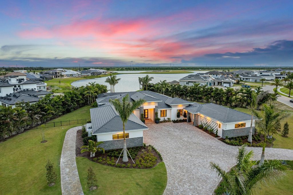 The Home in Rockledge, a lavish lakefront estate has a spacious family room, a fountain saltwater pool, spa, a gorgeous quartz island kitchen, an outdoor kitchen is now available for sale. This home located at 4574 Milost Dr, Rockledge, Florida