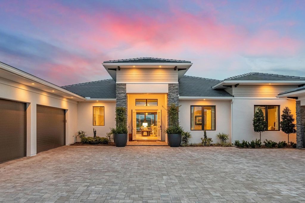 The Home in Rockledge, a lavish lakefront estate has a spacious family room, a fountain saltwater pool, spa, a gorgeous quartz island kitchen, an outdoor kitchen is now available for sale. This home located at 4574 Milost Dr, Rockledge, Florida