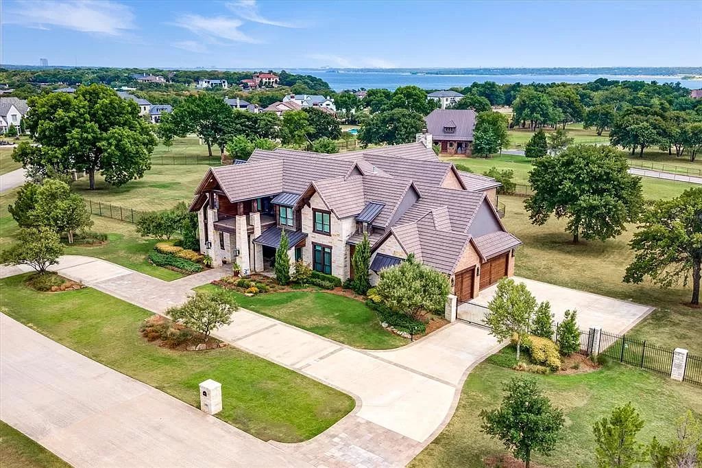 The Home in Flower Mound, a prominent 2 acre estate nestled in the gated and guarded neighborhood of Chateau de lac offering an impressive outdoor living and a picturesque entryway is now available for sale. This house located at 1901 Genevieve Ct, Flower Mound, Texas