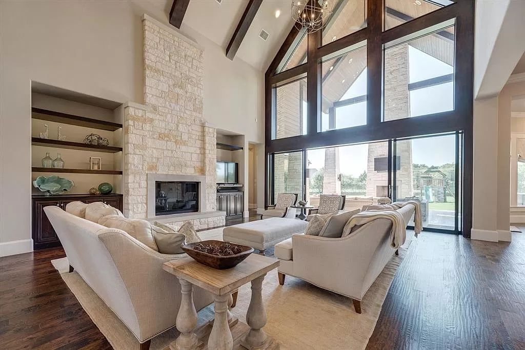The Home in Flower Mound, a prominent 2 acre estate nestled in the gated and guarded neighborhood of Chateau de lac offering an impressive outdoor living and a picturesque entryway is now available for sale. This house located at 1901 Genevieve Ct, Flower Mound, Texas
