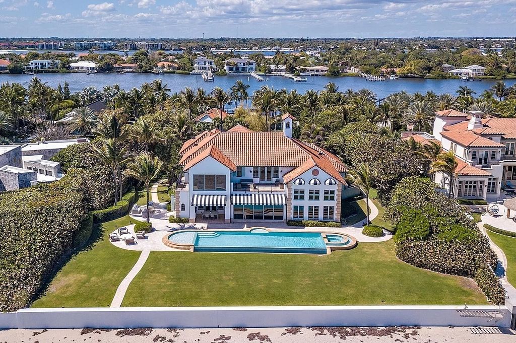 The Estate in Manalapan, a recently updated direct ocean and intracoastal home complete with open living areas, home theater, billiards room, artificial turf with 18-hole golf and tennis court, an infinity pool overlooking the Atlantic Ocean is now available for sale. This home located at 860 S Ocean Blvd, Manalapan, Florida