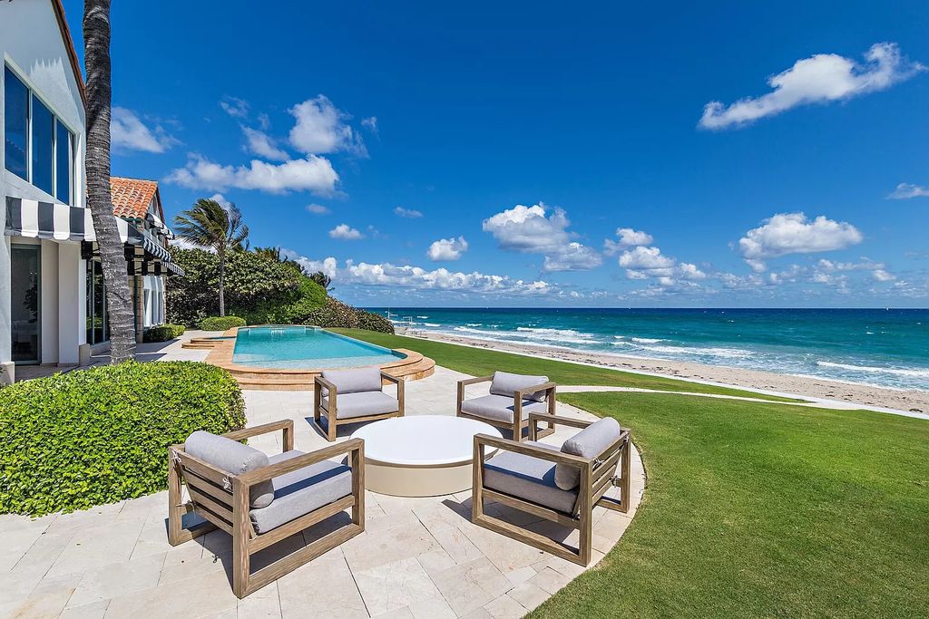 The Estate in Manalapan, a recently updated direct ocean and intracoastal home complete with open living areas, home theater, billiards room, artificial turf with 18-hole golf and tennis court, an infinity pool overlooking the Atlantic Ocean is now available for sale. This home located at 860 S Ocean Blvd, Manalapan, Florida