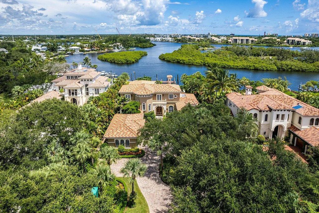 The Property in Jupiter, a magnificent Mediterranean inspired home with incredible water views, custom inlays of all ceilings, and an inviting well thought out floor plan is now available for sale. This home located at 317 Old Jupiter Beach Rd, Jupiter, Florida