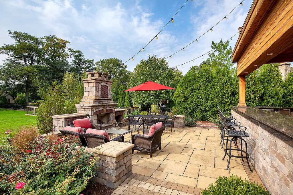The Home in Winnetka is surrounded with picturesque perennial flower and organic vegetable gardens, lush grounds, now available for sale. This home located at 102 Longmeadow Rd, Winnetka, Illinois