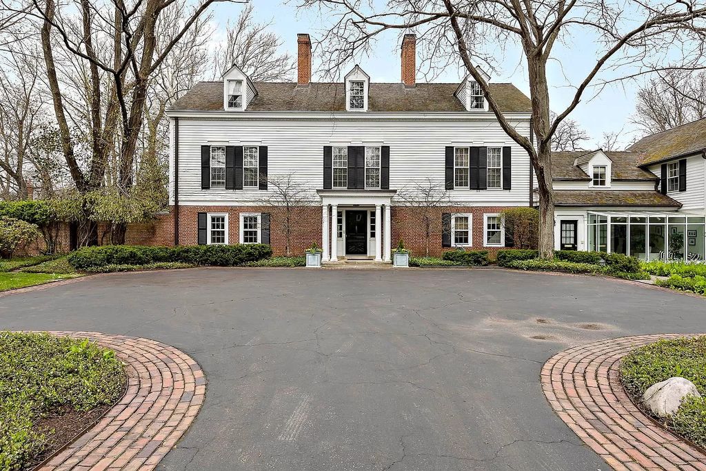 The House in Winnetka offers inviting two-story foyer with curved staircase and marble floors, now available for sale. This home located at 62 Woodley Rd, Winnetka, Illinois