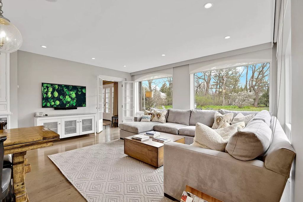 The House in Winnetka offers inviting two-story foyer with curved staircase and marble floors, now available for sale. This home located at 62 Woodley Rd, Winnetka, Illinois