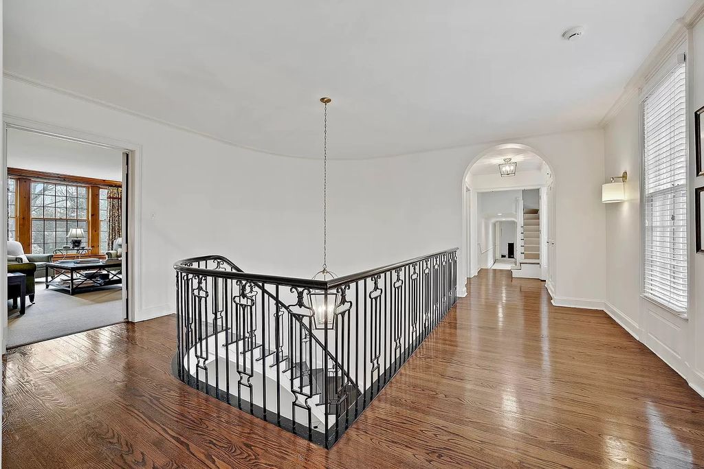 The House in Winnetka offers inviting two-story foyer with curved staircase and marble floors, now available for sale. This home located at 62 Woodley Rd, Winnetka, Illinois