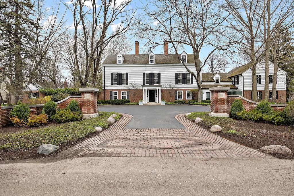 The House in Winnetka offers inviting two-story foyer with curved staircase and marble floors, now available for sale. This home located at 62 Woodley Rd, Winnetka, Illinois