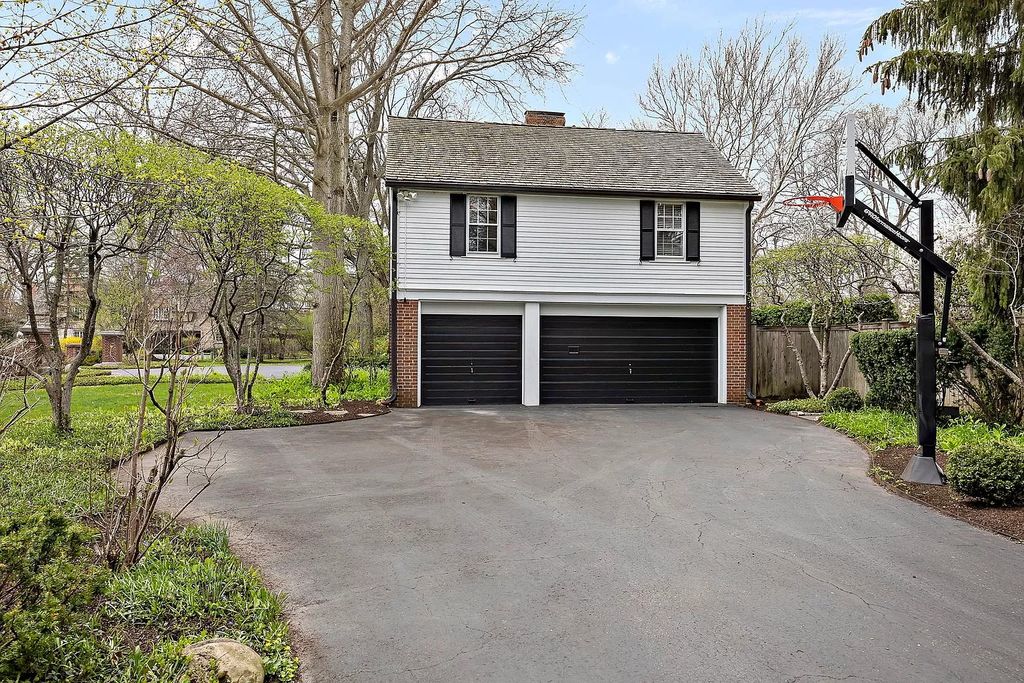 The House in Winnetka offers inviting two-story foyer with curved staircase and marble floors, now available for sale. This home located at 62 Woodley Rd, Winnetka, Illinois