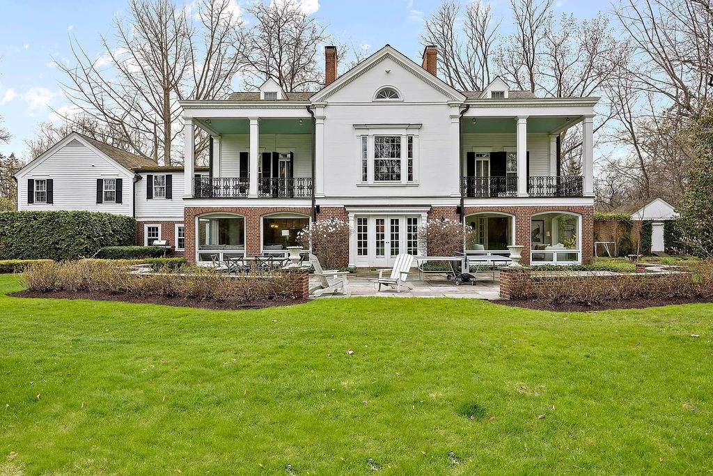 The House in Winnetka offers inviting two-story foyer with curved staircase and marble floors, now available for sale. This home located at 62 Woodley Rd, Winnetka, Illinois