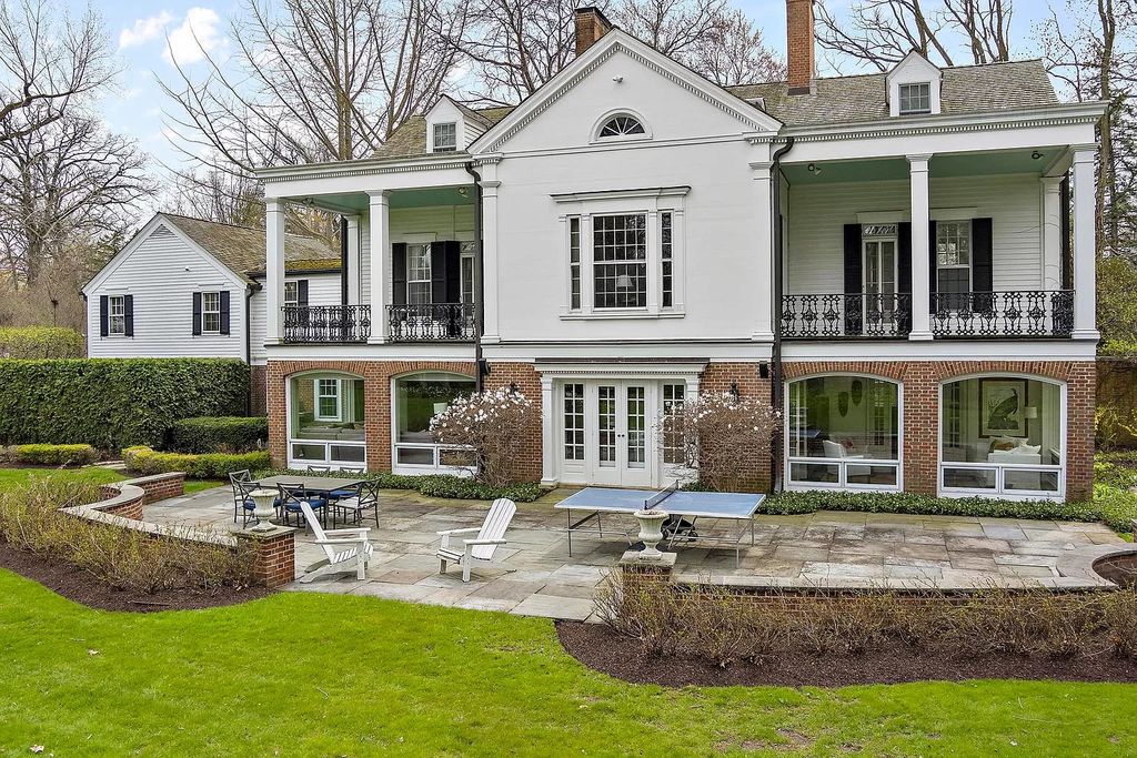 The House in Winnetka offers inviting two-story foyer with curved staircase and marble floors, now available for sale. This home located at 62 Woodley Rd, Winnetka, Illinois