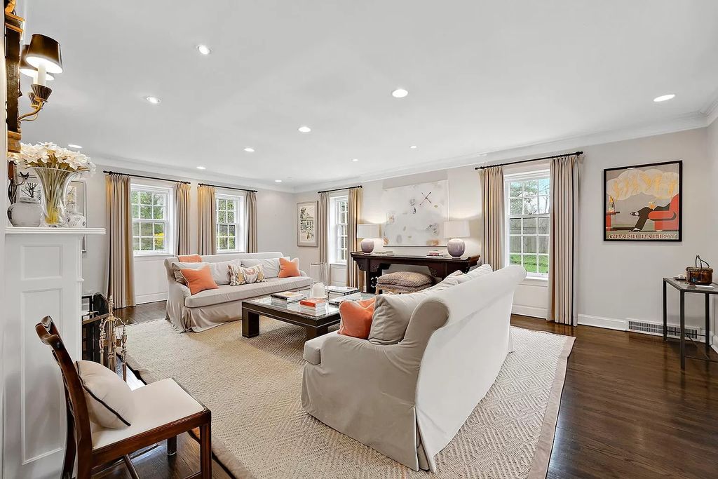 The House in Winnetka offers inviting two-story foyer with curved staircase and marble floors, now available for sale. This home located at 62 Woodley Rd, Winnetka, Illinois