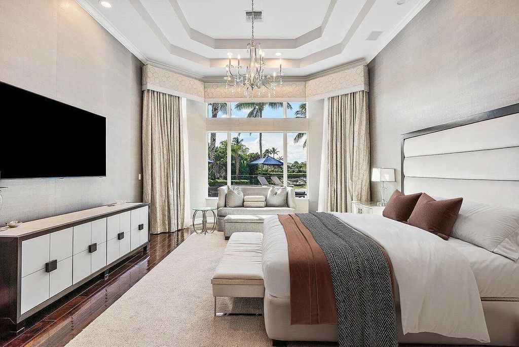 The Home in Boca Raton, a light-filled estate with SE exposure, impact windows with full amenities for entertaining including a media room, plus a waterfront resort-style pool, spa & covered outdoor Summer kitchen and more is now available for sale. This home located at 5826 Windsor Ter, Boca Raton, Florida