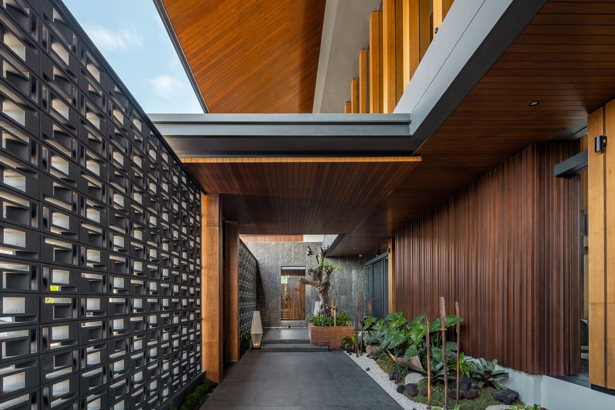 The Alia Residence with Modern Tropical Style in Indonesia by Axial Studio