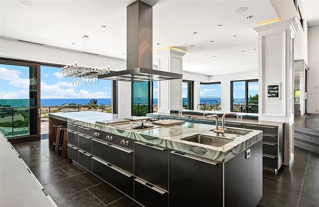 The Estate in Corona Del Mar, a breathtaking ocean and island view home with open layout design offering an unparalleled combination of beachside elegance and modern function is now available for sale. This home located at 4700 Surrey Dr, Corona Del Mar, California