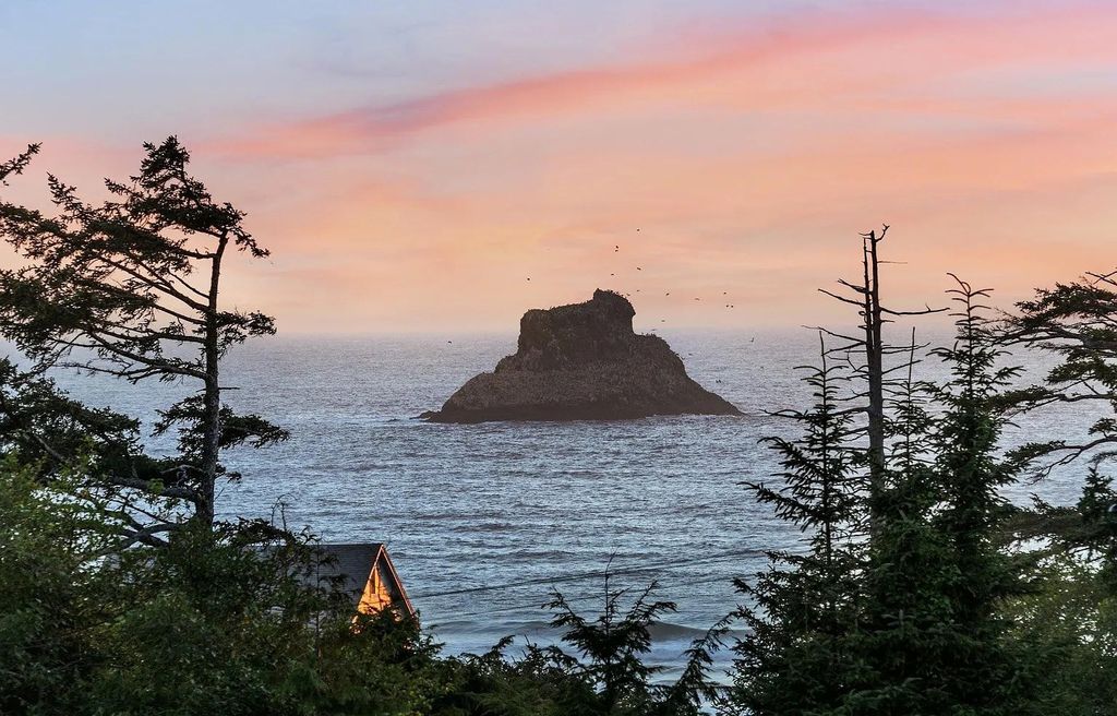 The Estate in Arch Cape is a luxurious home situated on secluded acres adjacent to Sandy Beach and Cannon Beach Fine Dining and Shops now available for sale. This home located at 31970 E Ocean Ln, Arch Cape, Oregon; offering 11 bedrooms and 11 bathrooms with 9,500 square feet of living spaces.