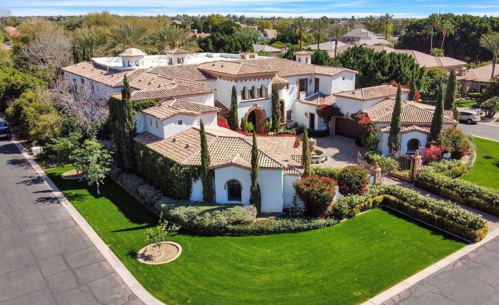 The Estate in Mesa, a an entertainer's dream designed for resort-like living with over 14,000 square feet of pure luxury offering a lush formally landscaped sanctuary and countless amenities is now available for sale. This home located at 1550 N 40th St UNIT 14, Mesa, Arizona