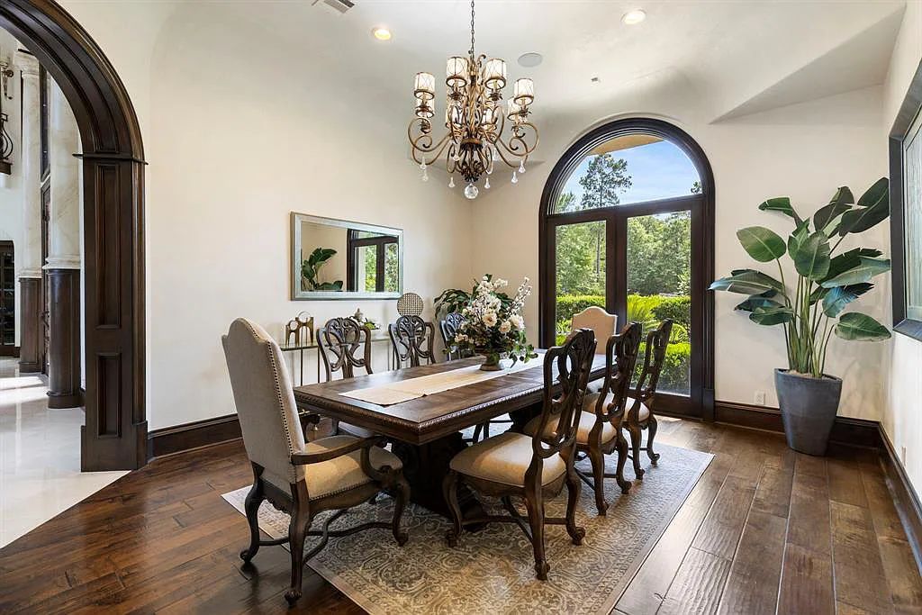 The Home in Spring, a dream property with details in every corner, lots of natural light throughout featuring a floating staircase, covered patio deck with summer kitchen and fireplace and more is now available for sale. This home located at 26 Norlund Way, Spring, Texas