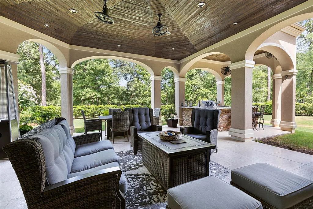 The Home in Spring, a dream property with details in every corner, lots of natural light throughout featuring a floating staircase, covered patio deck with summer kitchen and fireplace and more is now available for sale. This home located at 26 Norlund Way, Spring, Texas