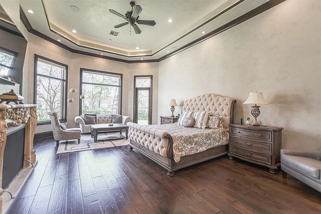 The Home in Spring, a dream property with details in every corner, lots of natural light throughout featuring a floating staircase, covered patio deck with summer kitchen and fireplace and more is now available for sale. This home located at 26 Norlund Way, Spring, Texas