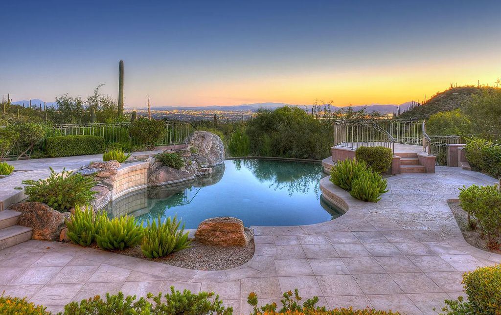 The Home in Tucson, a spectacular all-masonry stucco mansion nestled in prestigious, gated The Canyons offers sweeping city, mountain, sunset and sunrise views is now available for sale. This home located at 7582 N Secret Canyon Dr, Tucson, Arizona