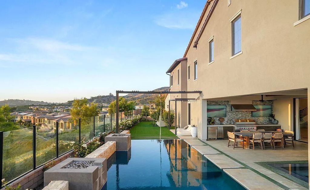 The Home in Irvine, an exceptional estate combines the ultimate in interior finishes and exterior amenities offering incredible panoramic city and canyon views is now available for sale. This home located at 100 Dry Crk, Irvine, California