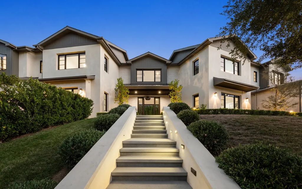 The Farmhouse in Encino, a gated privacy home enchants with tall hedges, rolling lawns and an exquisite exterior offering breathtaking 9,380 square foot floorplan across two levels is now available for sale. This home located at 16766 Bosque Dr, Encino, California