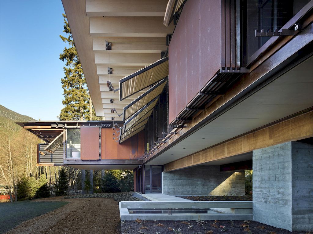 Whistler Ski House in Canada with a glass - walled bridge by Olson Kundig