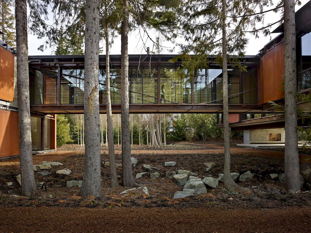 Whistler Ski House in Canada with a glass - walled bridge by Olson Kundig