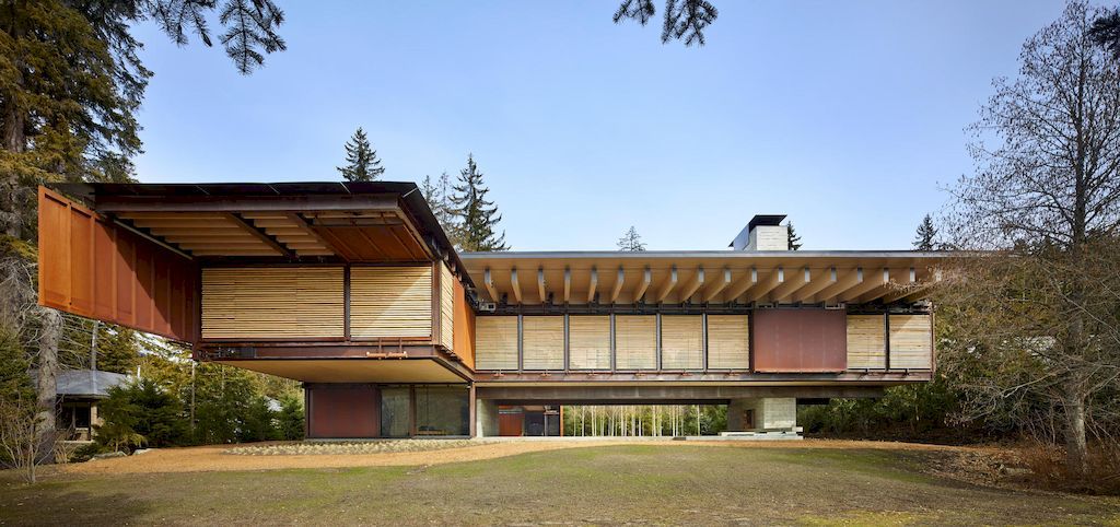 Whistler Ski House in Canada with a glass - walled bridge by Olson Kundig