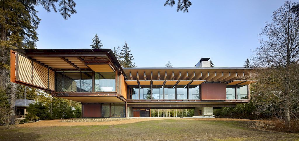 Whistler Ski House in Canada with a glass - walled bridge by Olson Kundig