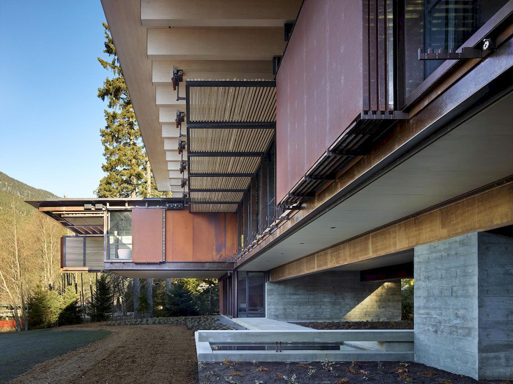 Whistler Ski House in Canada with a glass - walled bridge by Olson Kundig