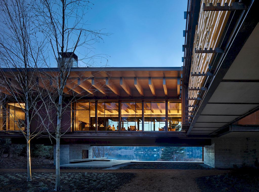 Whistler Ski House in Canada with a glass - walled bridge by Olson Kundig