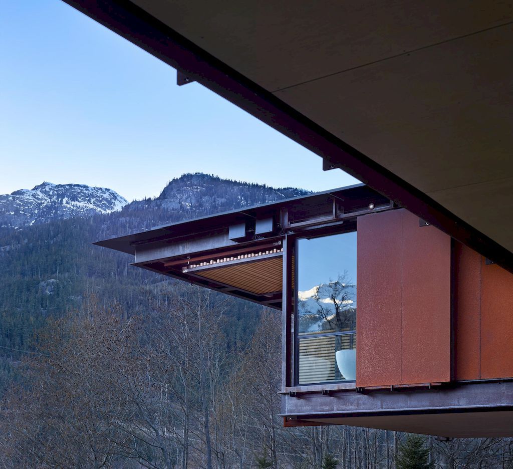 Whistler Ski House in Canada with a glass - walled bridge by Olson Kundig