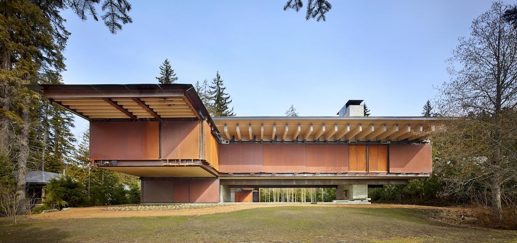 Whistler Ski House in Canada with a glass - walled bridge by Olson Kundig