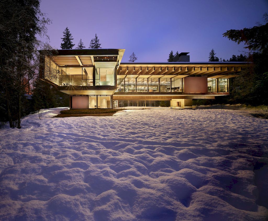 Whistler Ski House in Canada with a glass - walled bridge by Olson Kundig