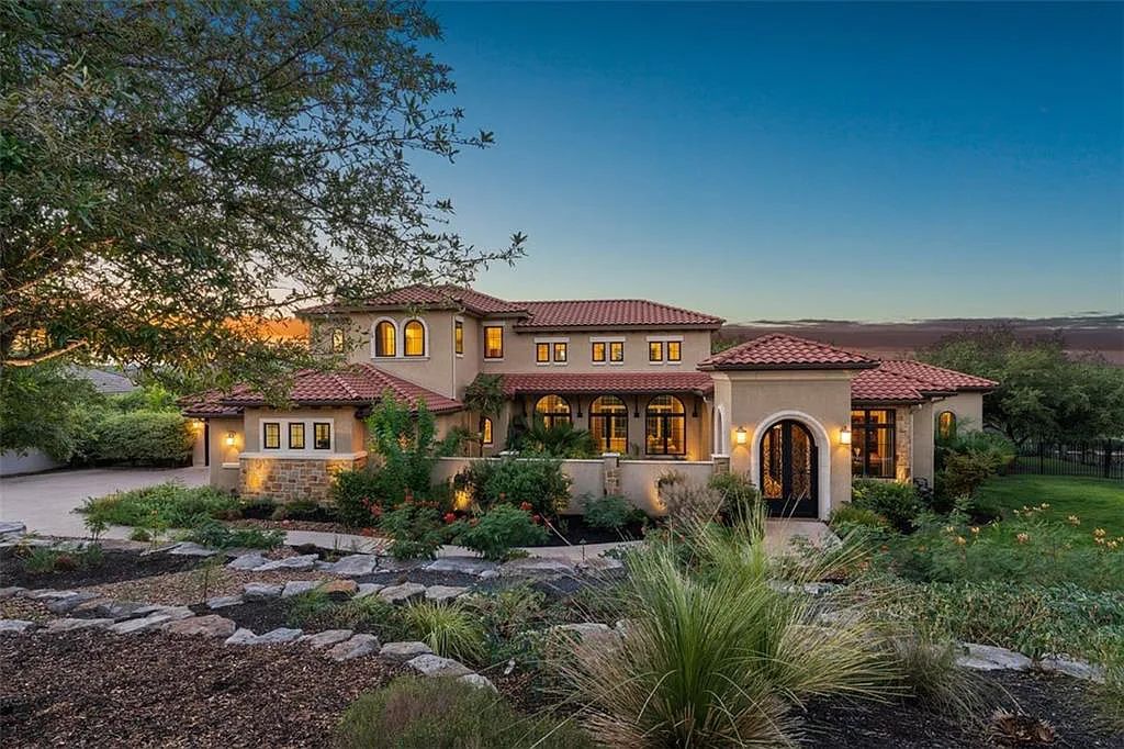 13209 Zen Gardens Way, Austin, Texas is an absolutely stunning home in the heart of Steiner Ranch in the Gated Community with sweeping views of Lake Austin and the hill country.