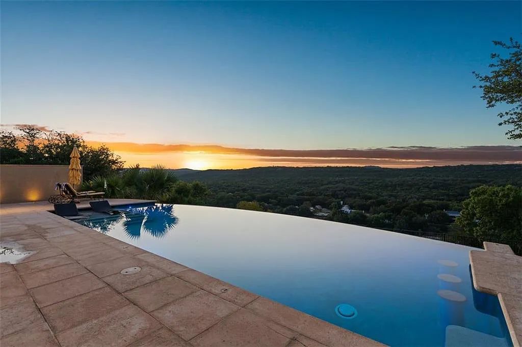 13209 Zen Gardens Way, Austin, Texas is an absolutely stunning home in the heart of Steiner Ranch in the Gated Community with sweeping views of Lake Austin and the hill country.