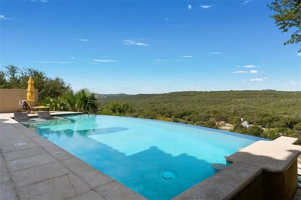 13209 Zen Gardens Way, Austin, Texas is an absolutely stunning home in the heart of Steiner Ranch in the Gated Community with sweeping views of Lake Austin and the hill country.