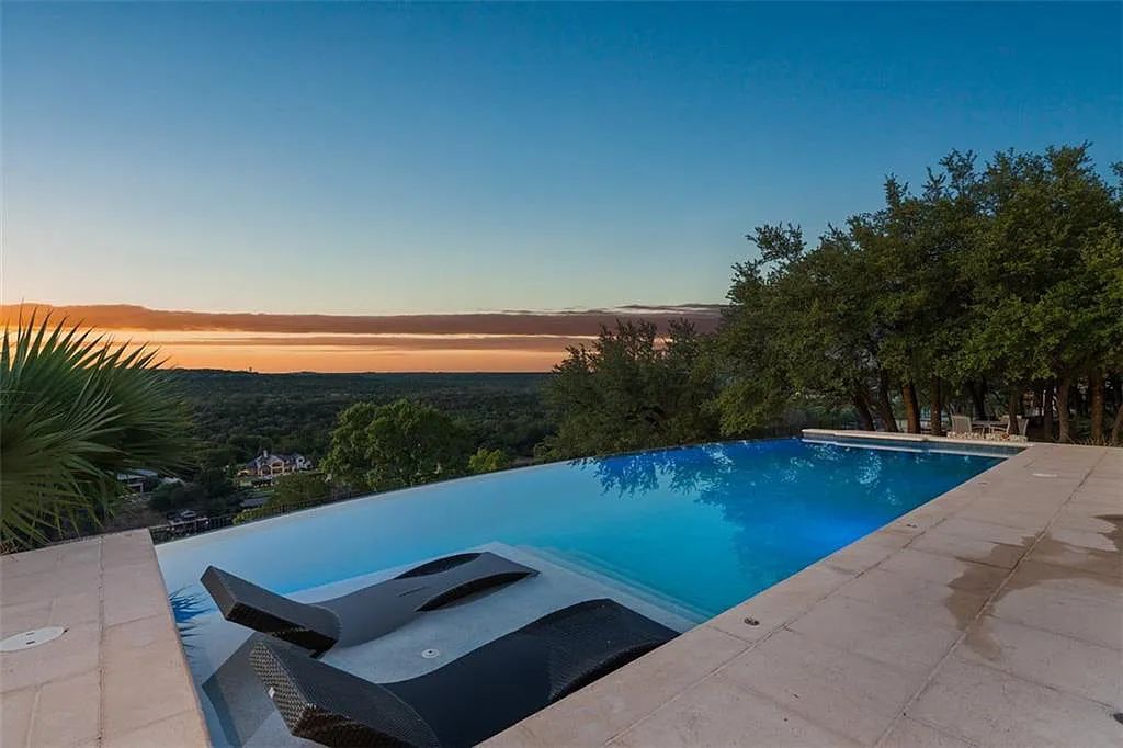 13209 Zen Gardens Way, Austin, Texas is an absolutely stunning home in the heart of Steiner Ranch in the Gated Community with sweeping views of Lake Austin and the hill country.