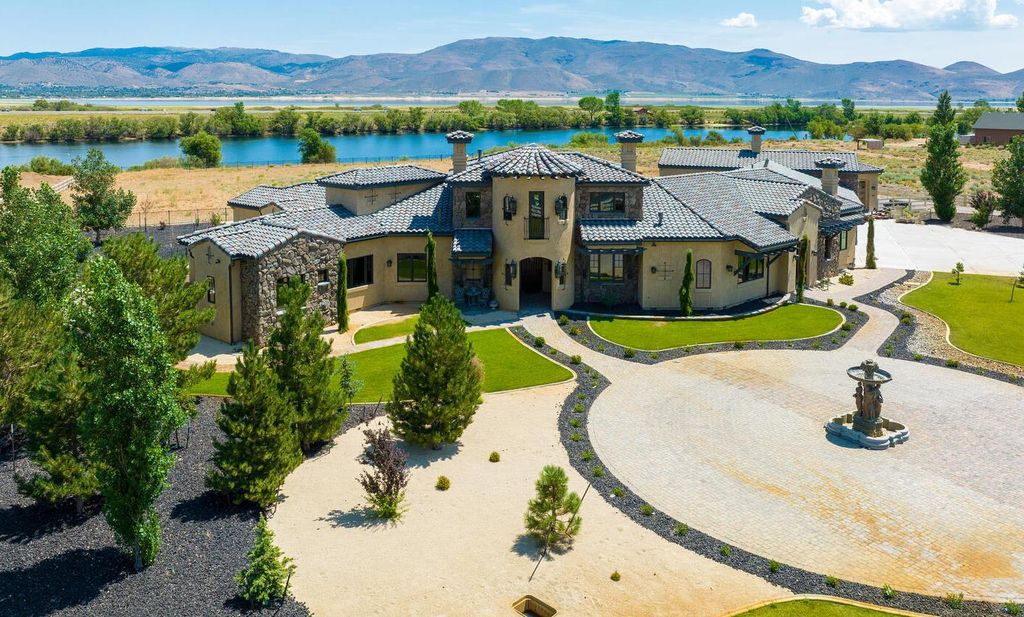 18250 Lake Vista Rd, Washoe Valley City, Nevada is a custom European-style home features superior quality finishes throughout situated on a private water-ski lake in Hidden Lake Ranch.