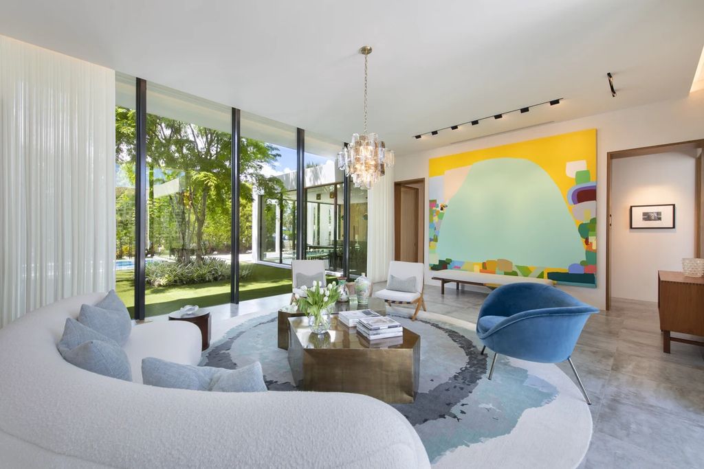 121 Nurmi Dr, Fort Lauderdale, Florida is a sophisticated modernist estate built in 2020 by renown architect Daniel Kahan from Smith and Moore with unbelievable features including beautiful lighting, private gardens, summer kitchen and more.