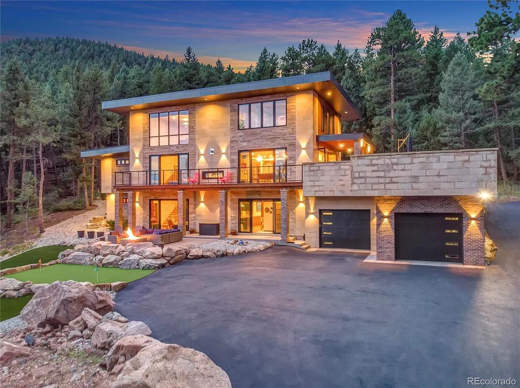 7793 Elk Path Way, Morrison, Colorado is a distinctive architectural style home designed with indoor outdoor living in mind the wrap around deck and patios provide incredible views and entertaining opportunities day and night. 