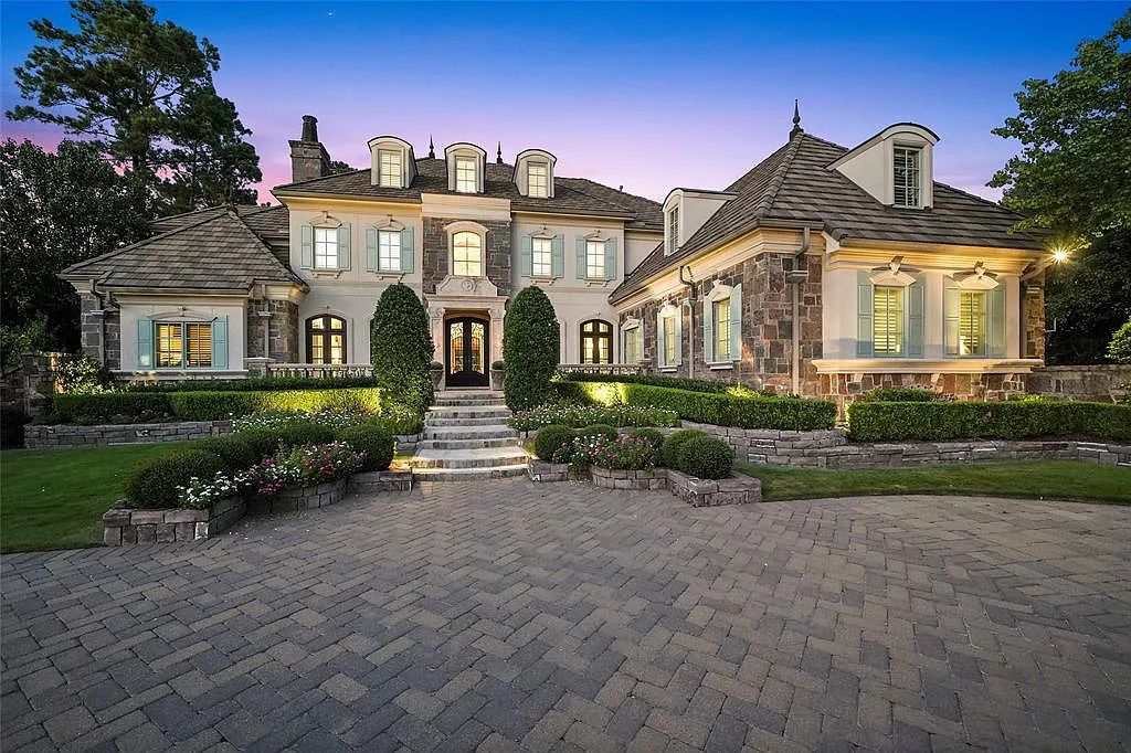 10 Philbrook Way, Spring, Texas is a French inspired magnificent estate on nearly an acre waterfront lot offers elegant outdoor loggias, spectacular pool & fountains, vibrant gardens & serene pond. 800+ bottle climatized sunken wine room.