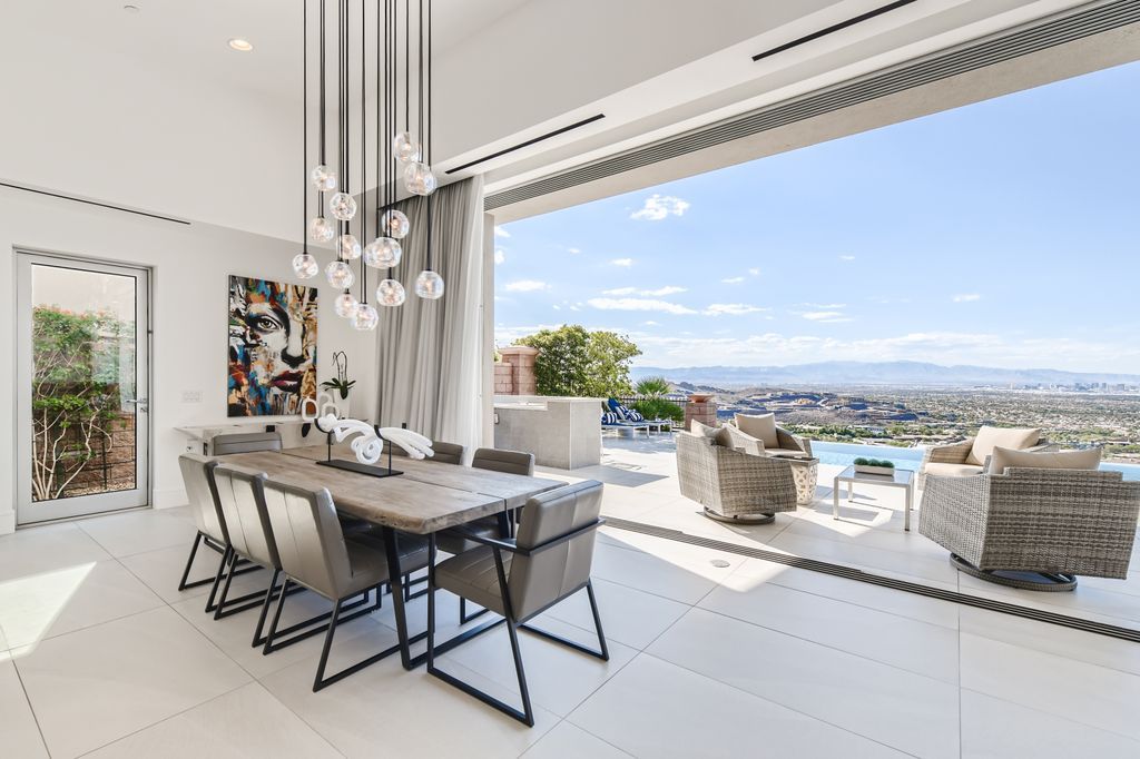 The Home in Henderson, a MacDonald Highlands residence offers a bright and open floor plan, an amazing backyard with infinity edge pool, spa, outdoor kitchen with bbq, fire pit and lounge area is now available for sale. This home located at 667 Palisade Rim Dr, Henderson, Nevada