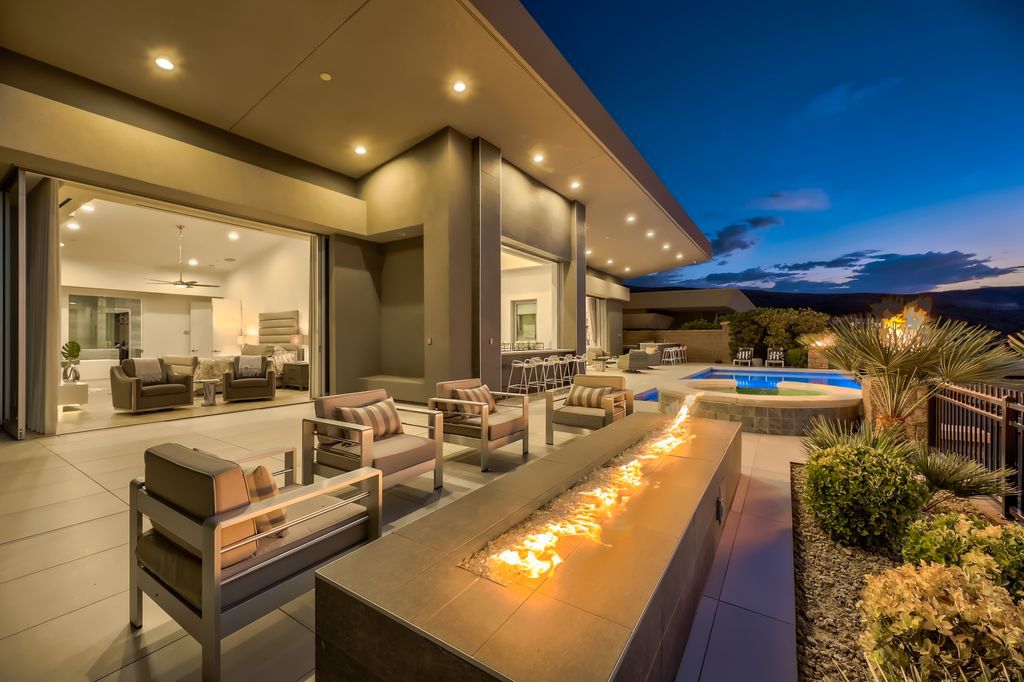 The Home in Henderson, a MacDonald Highlands residence offers a bright and open floor plan, an amazing backyard with infinity edge pool, spa, outdoor kitchen with bbq, fire pit and lounge area is now available for sale. This home located at 667 Palisade Rim Dr, Henderson, Nevada